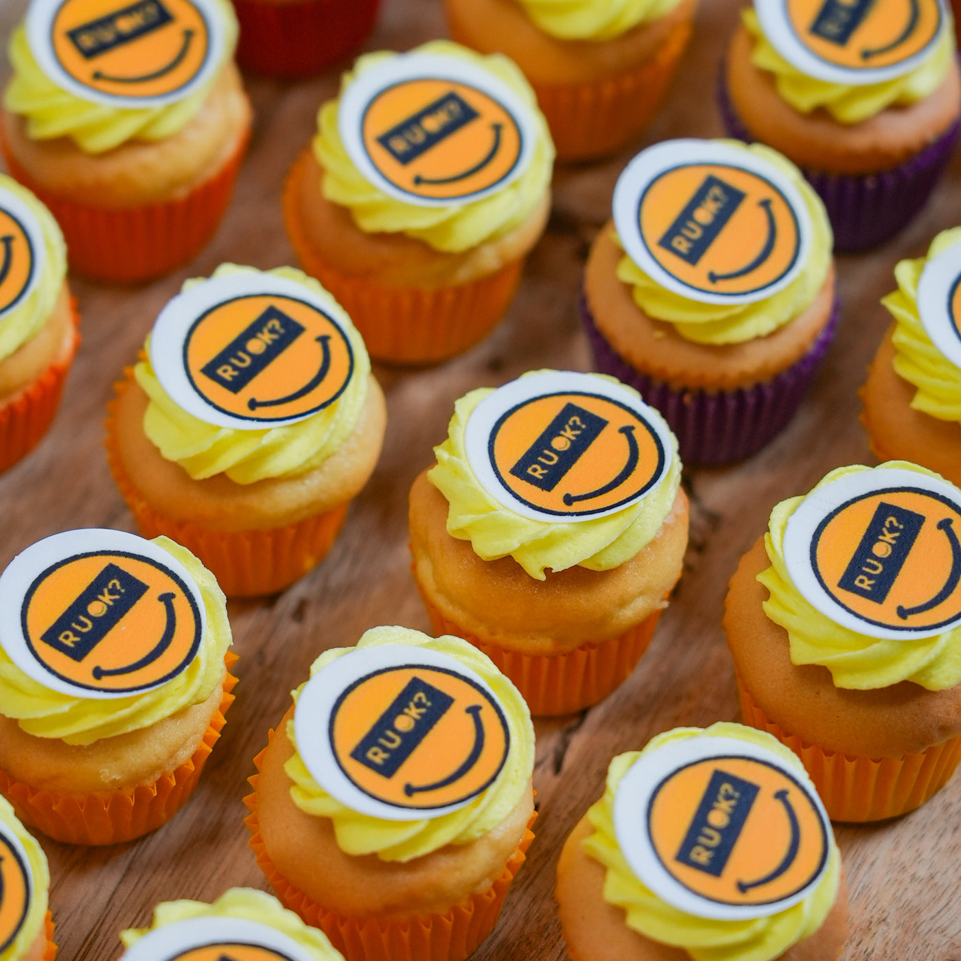 R U OK? cupcakes iced with the yellow smiley, on a table in Brisbane