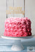 pink-rosette-birthday-cakes-with-sign-on-top